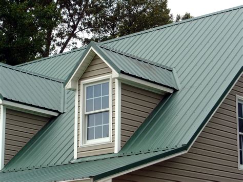 what color to paint house with green metal roof|matching paint to green roof.